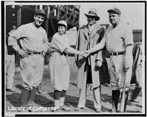 Jackie Mitchell shakes hands with Babe Ruth in 1931.