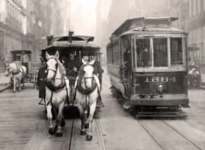 Horse drawn and motorized early trolleys in New York City.