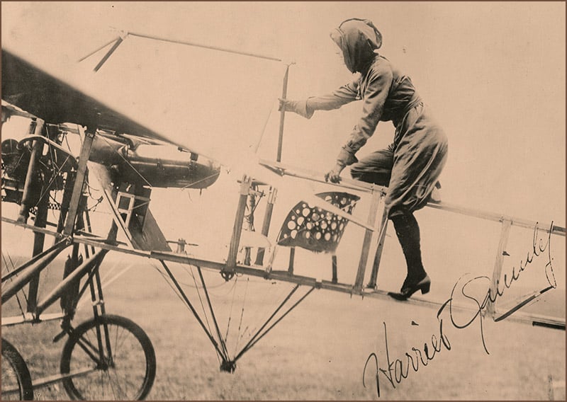 Harriet Quimby climbs into the plane in which she became the first U.S. woman to earn a pilot's license.