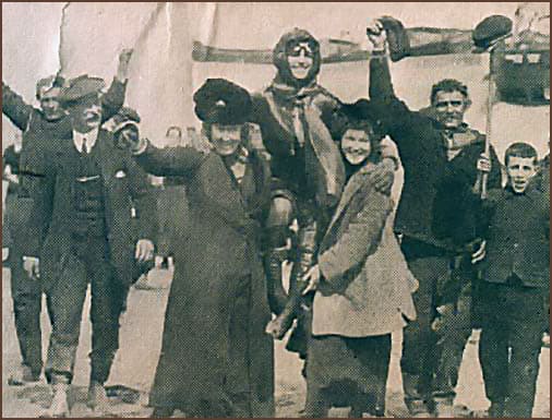 French villages hoist Harriet Quimby on their shoulders after she flew the English Channel and landing in France.