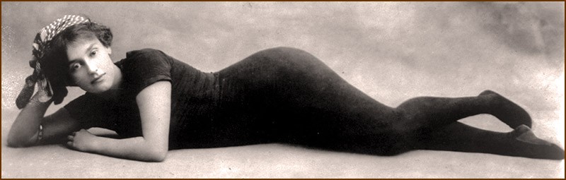 Annette Kellerman lounging in her body-fitting swimsuit.