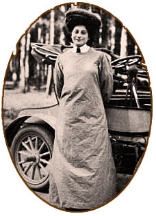 Standing by a Napier motor car, race care driver and mechanic Dorothy Levitt displayed her coveralls.