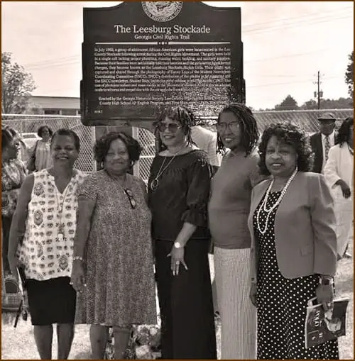 Five of the Leesburg Stockade Girls in  2019 at a new historic plaque that tells their 1963 story