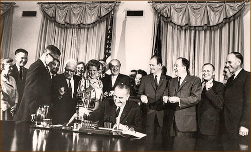 LBJ signing the Food Stamp Act in 1964