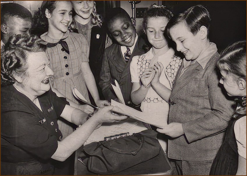 Nila Mac with a group of her child radio actors